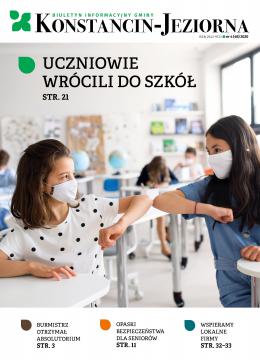 okładka wydania; dwie uczennice w maseczkach witające się łokciami w szkolnej ławce